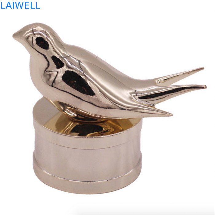 Moderne en modieuze zink legering parfumfleskappen met aangepast vogelontwerp voor high-end geuren